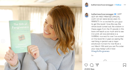 katherine holding up her book on her instagram feed 